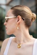 Arracada gruesa con perla y sol colgante acero