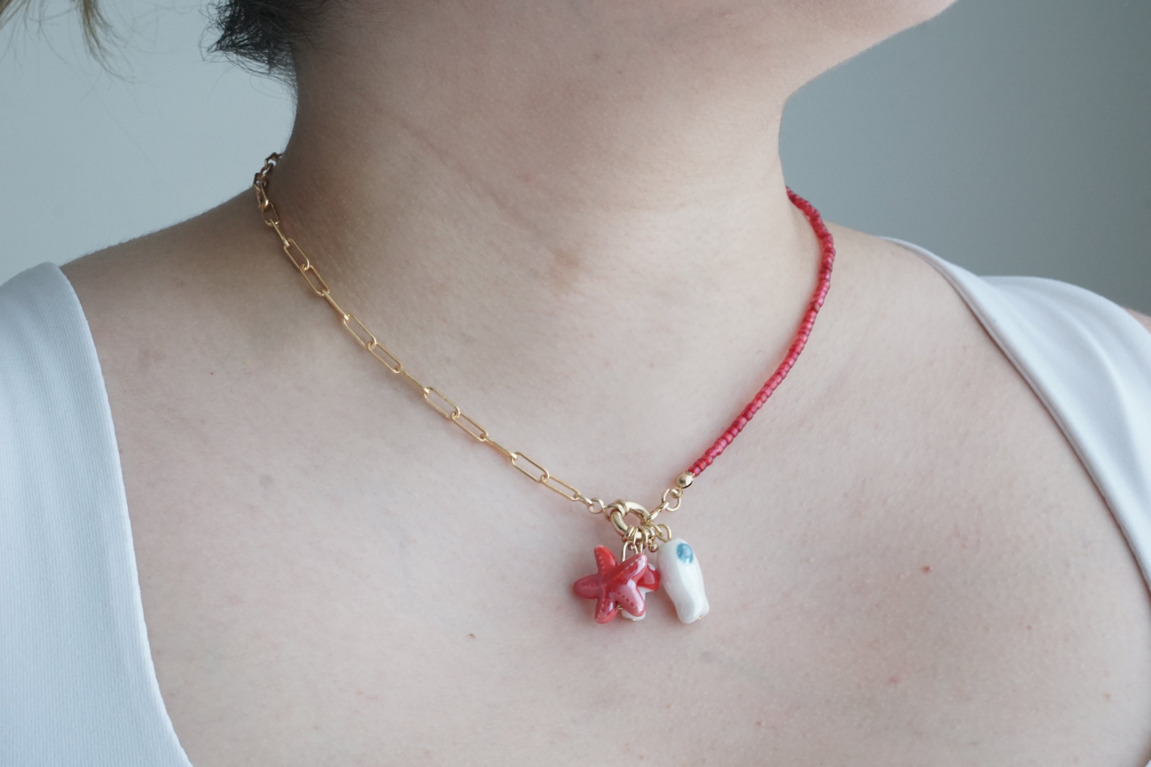 ceramic charms and steel necklace