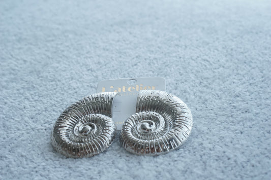 aretes conchas acero inoxidable