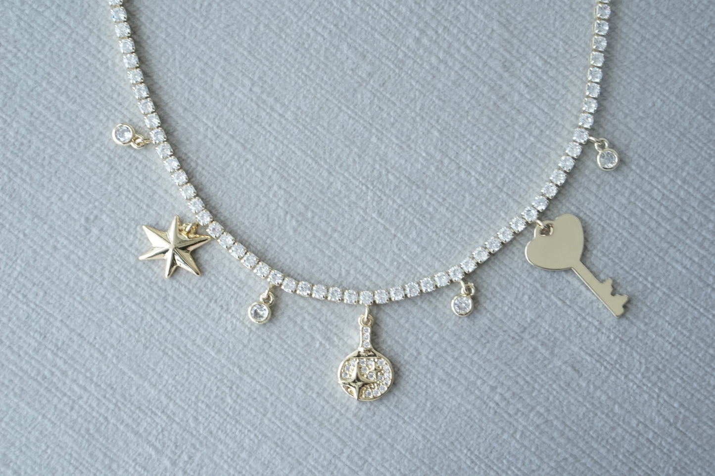 Collar key y corazon tennis