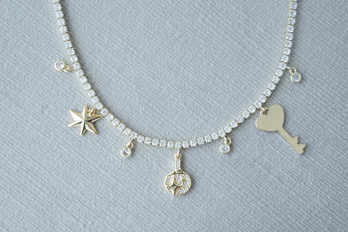 Collar key y corazon tennis