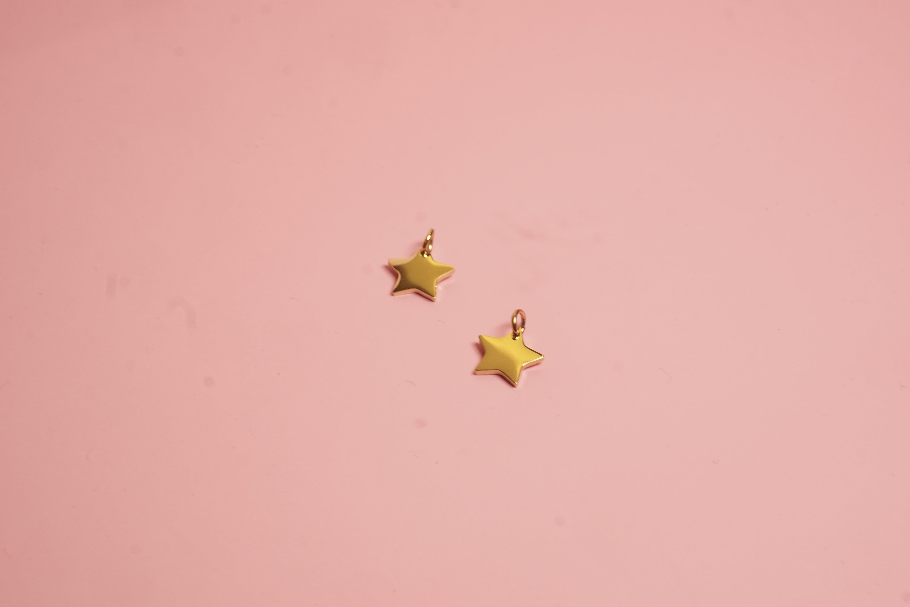 Charm estrella acero