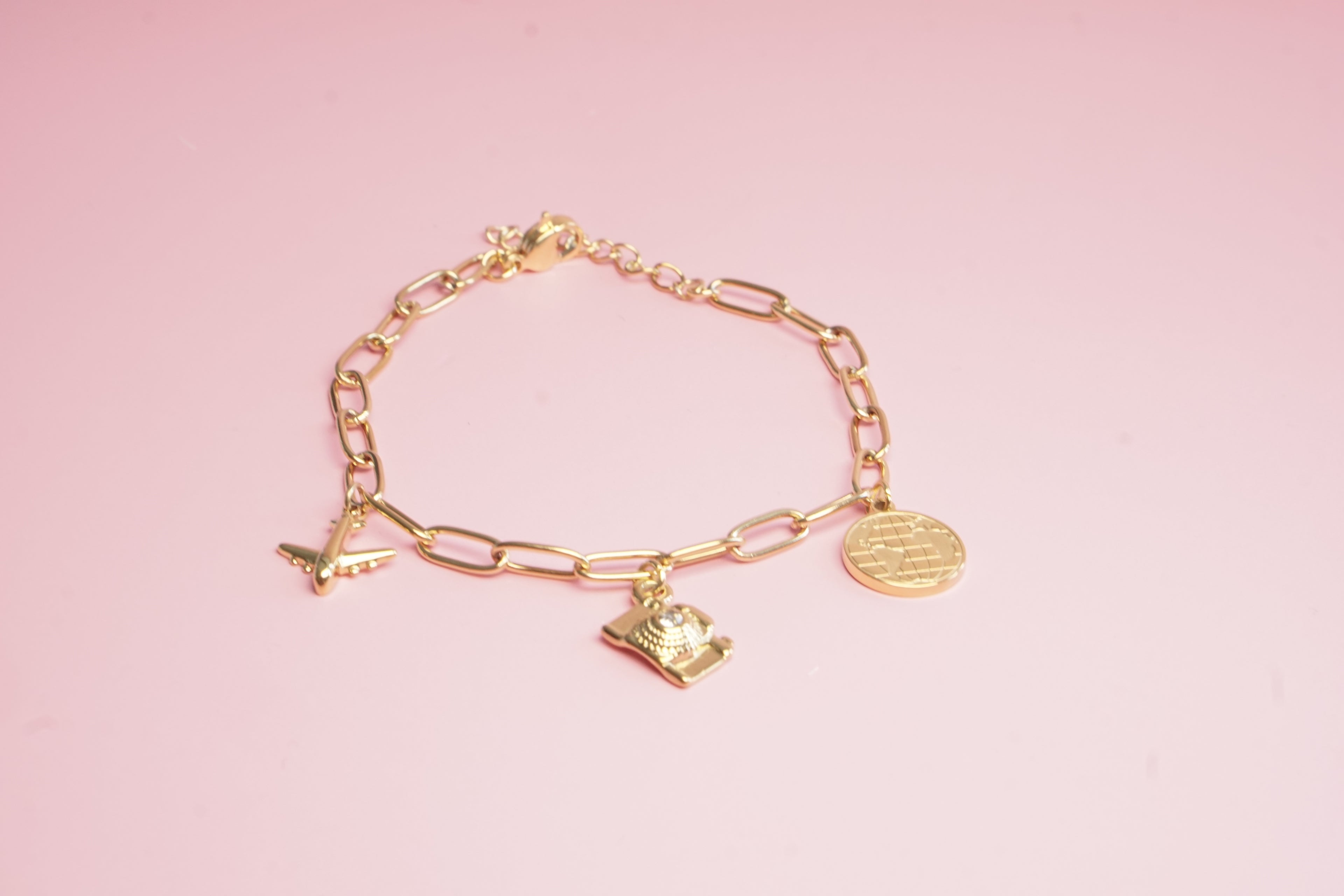 PULSERA DE ESLABONES CON DIJES DE AVION CAMARA