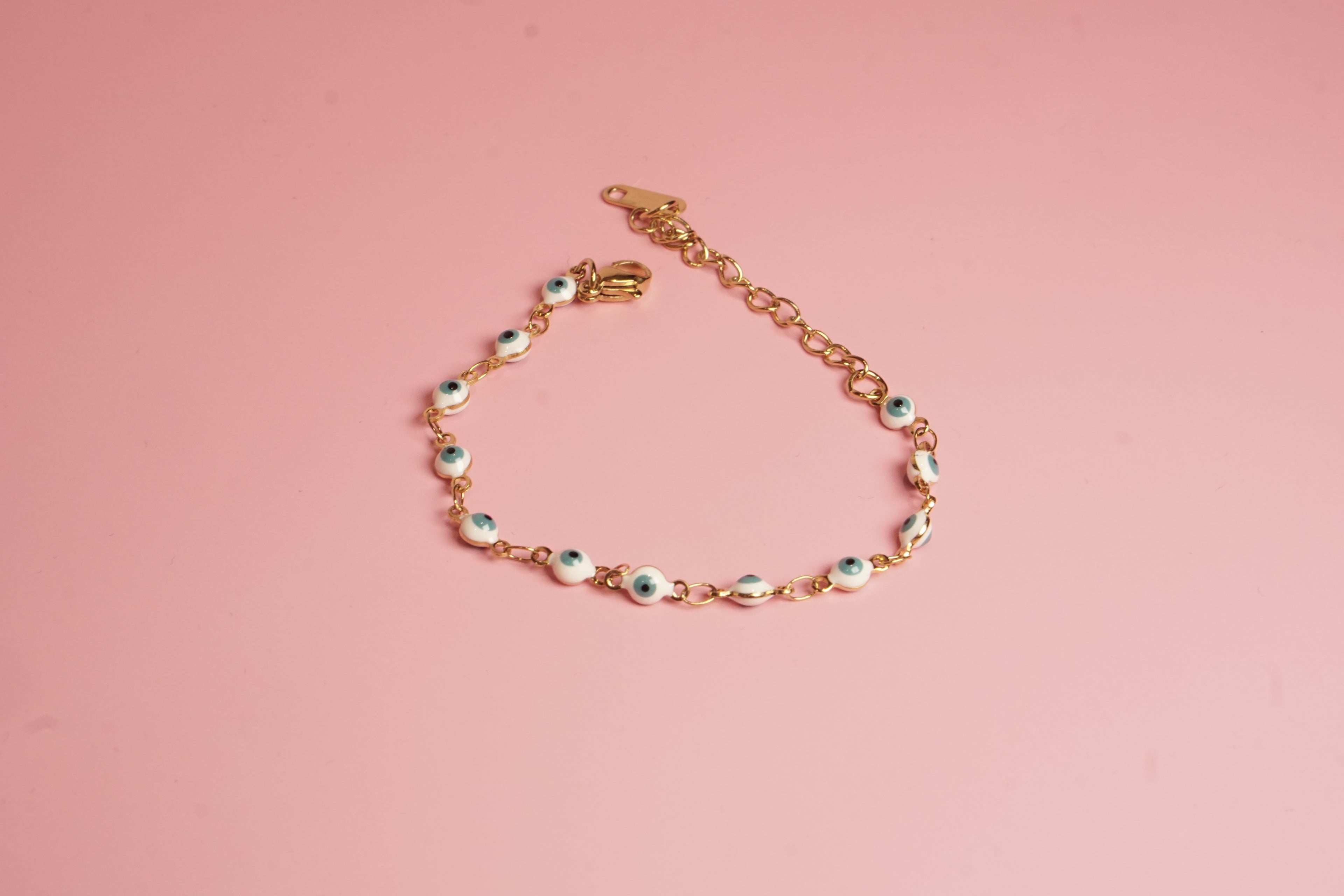 PULSERA DE OJITOS 4MM BLANCO 15CM DORADO