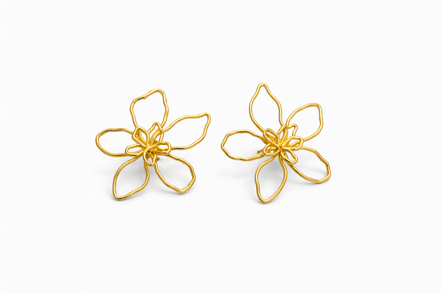 Aretes flor alargada ch14k silueta