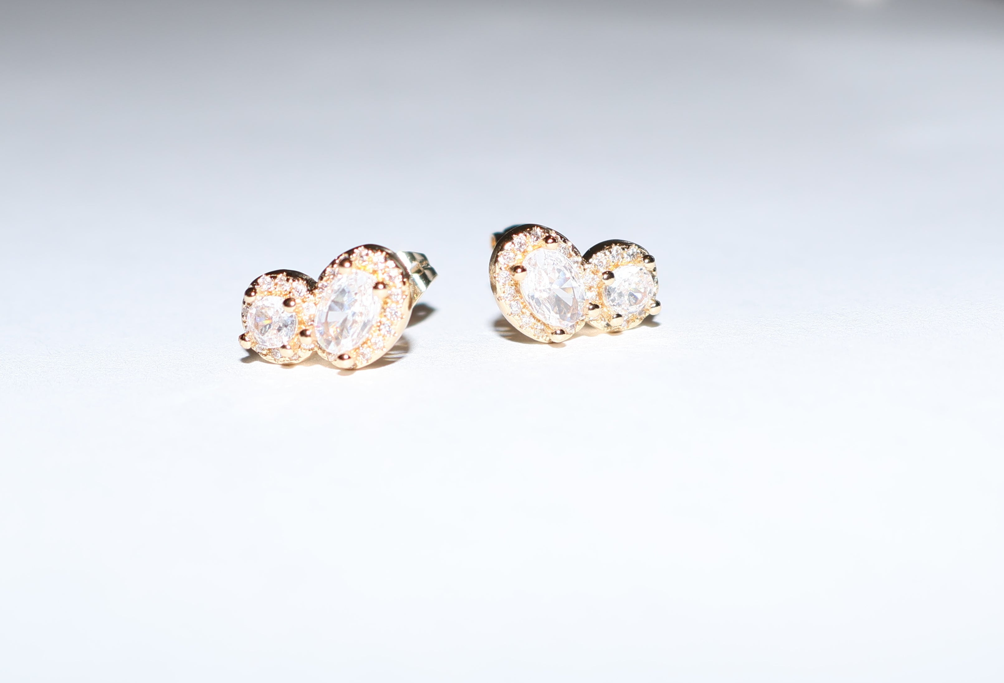 Aretes tipo broquel doble zirconia
