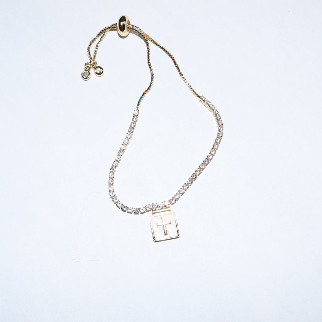 Pulsera tipo tennis con cruz