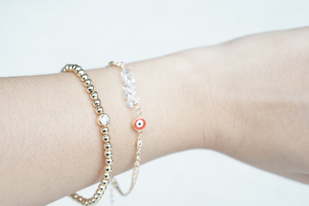 Twisted Cuban Bracelet with Iridescent Crystal Eye – Gold