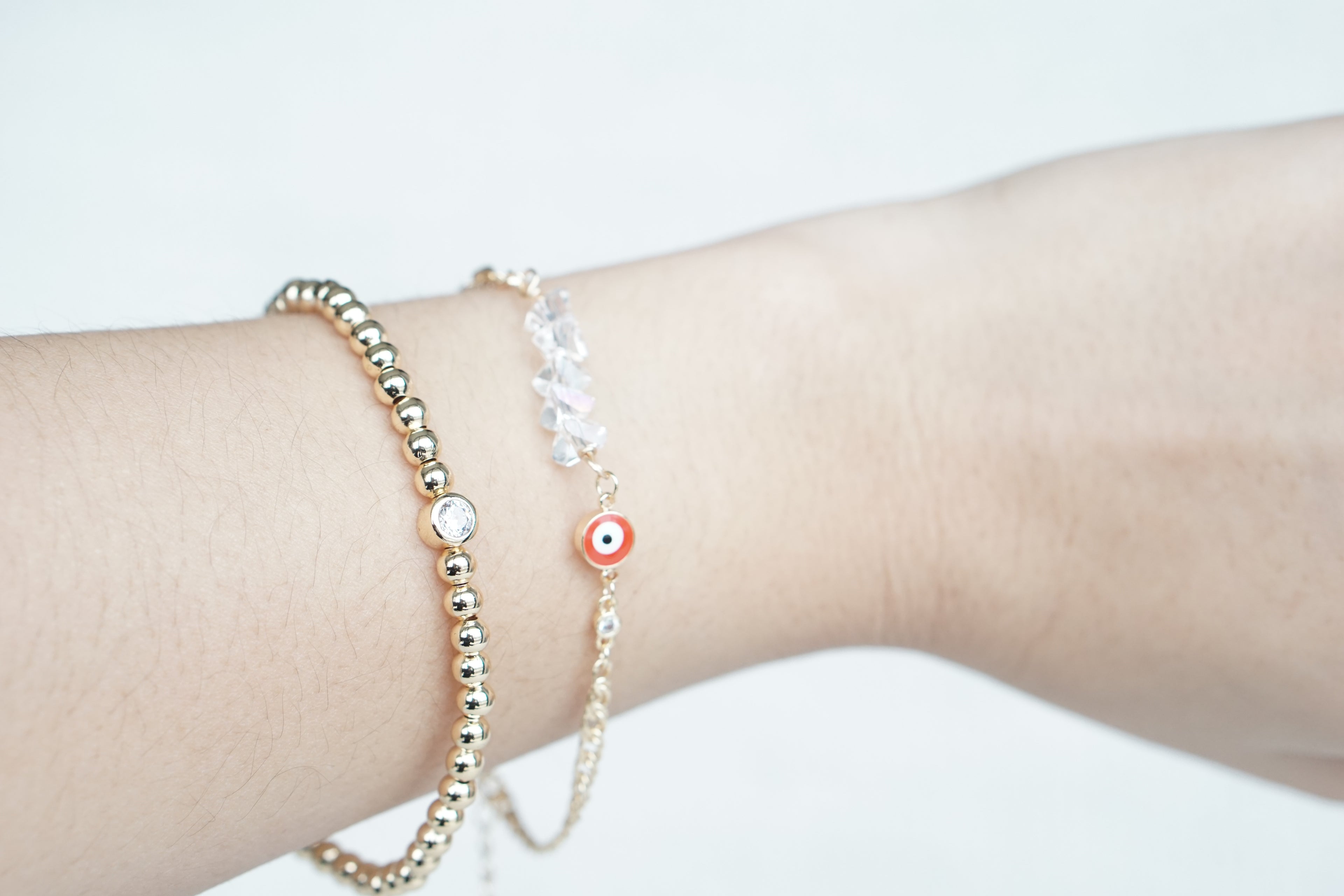 Twisted Cuban Bracelet with Iridescent Crystal Eye – Gold