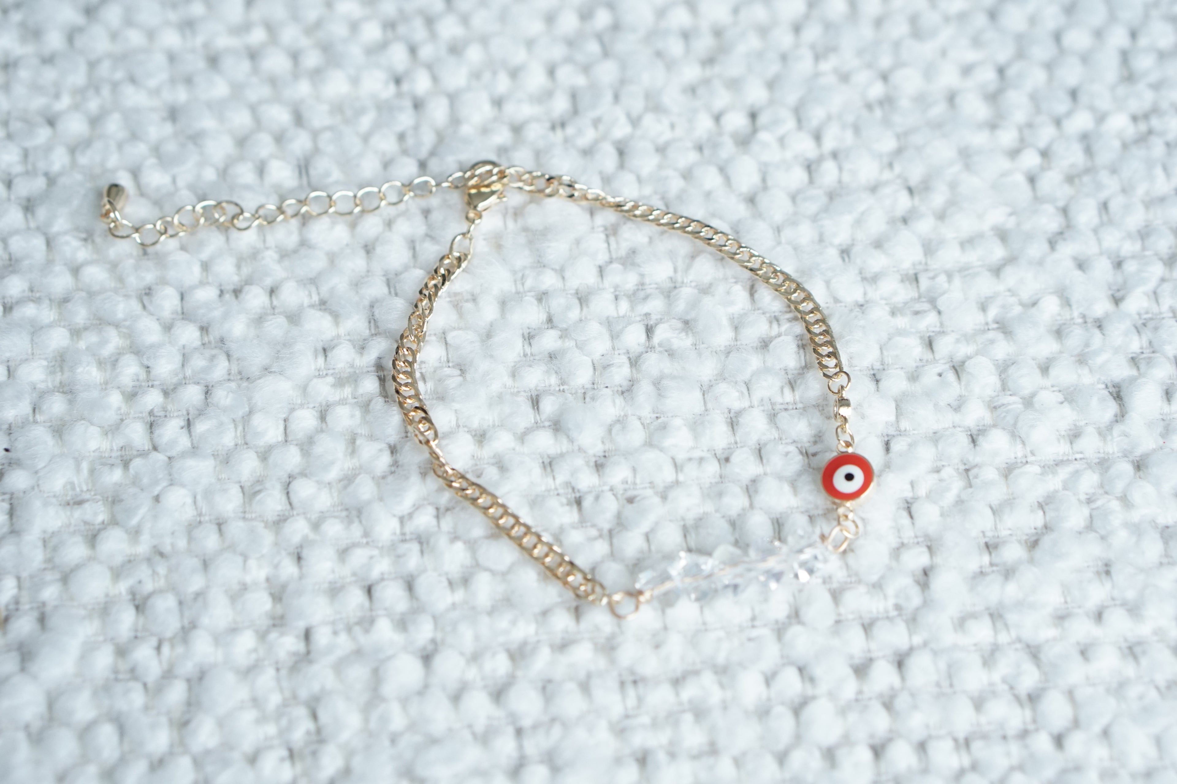 Twisted Cuban Bracelet with Iridescent Crystal Eye – Gold